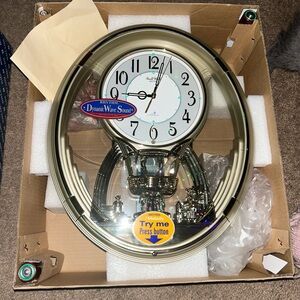 Unused disney "small world" clock 19 years old gold